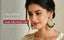 Modern Indian woman in ivory silk blouse wearing the Nuyug Rani Chandbali Earrings with kundan stones and pearl drops, rendered as bust-up campaign portrait