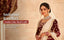 North Indian bride in deep maroon bridal lehenga wearing a Nuyug AAA cubic zirconia bridal necklace, chandbali earrings, maang tikka and traditional nose chain that look like real 22K gold