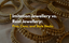 Gold bangles placed over beige surface with overlay text “Imitation Jewellery vs. Real Jewellery: Pros, Cons, and Style Hacks”
