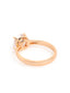 A gold-toned solitaire ring featuring a brilliant round-cut AAA cubic zircon stone on a sleek band